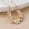 POM: Golden Wave Pendant Necklace
