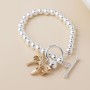 POM: Silver Plated Bead Bracelet with Golden Bow Charm